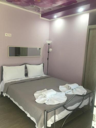 Ένα ή περισσότερα κρεβάτια σε δωμάτιο στο Katrine Seaside Rooms #PROPERTLY