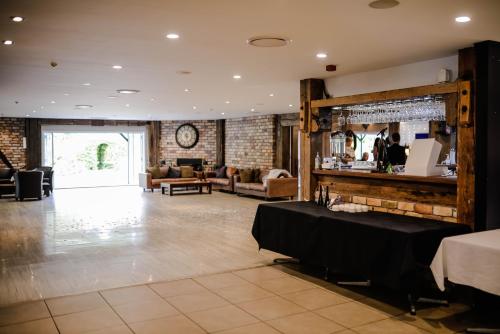 a lobby with a table in a room at Northridge Golf Resort in Orewa