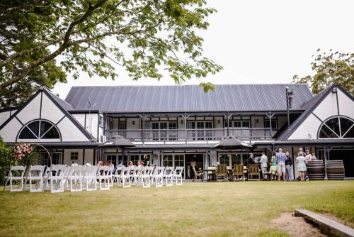 a group of people standing in front of a building at Northridge Golf Resort in Orewa