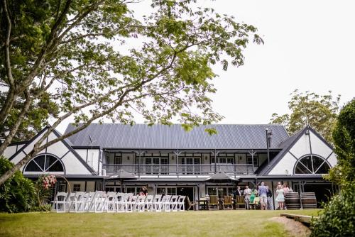 a group of people standing in front of a building at Northridge Golf Resort in Orewa