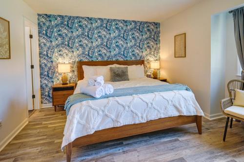 a bedroom with a bed with two towels on it at Cozy High Point Vacation Rental Near HPU Campus in High Point