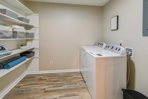 a laundry room with a washer and dryer at Cozy High Point Vacation Rental Near HPU Campus in High Point