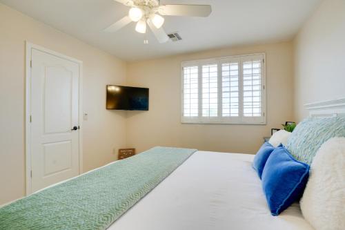 a bedroom with a bed and a ceiling fan at Pool, Patio and Hot Tub Surprise Home Near Golfing! in Surprise