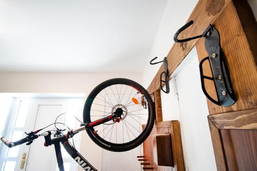 a bike on a bike rack hanging from a wall at Ubytování u Nováků in Malá Morávka