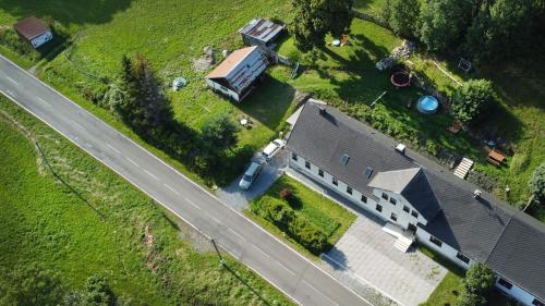 an overhead view of a house and a road at Ubytování u Nováků in Malá Morávka