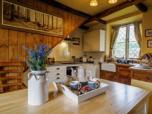 a kitchen with a table with a tray of food at Sweet Knoll Farm in Peak Forest