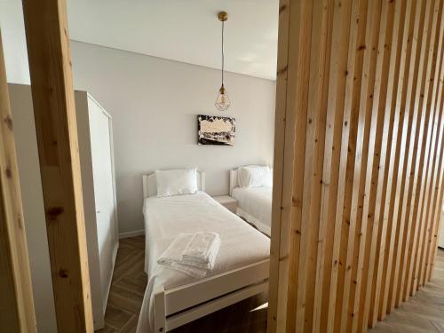 Postel nebo postele na pokoji v ubytování Custódio Ocean View