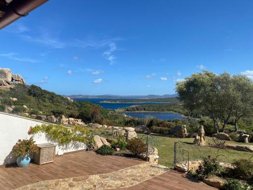 a patio with a view of a lake at Villa Erica a Valle Dell Erica in Valle Dell’Erica