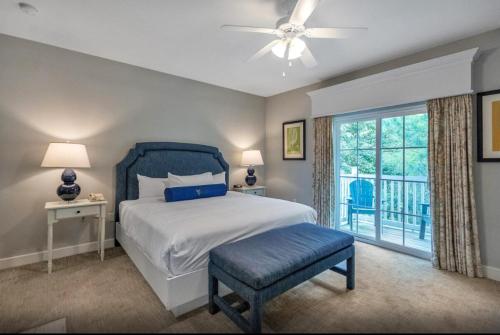 a bedroom with a large bed and a window at King's Creek Plantation in Williamsburg