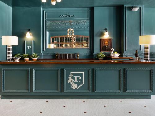a bar in a room with blue walls at Palihotel San Diego Gaslamp Quarter in San Diego