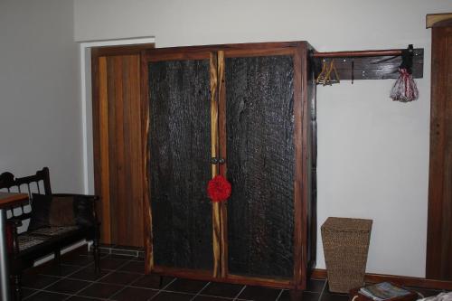 a glass door with a red flower on it at Olive Tree B&B in Upington