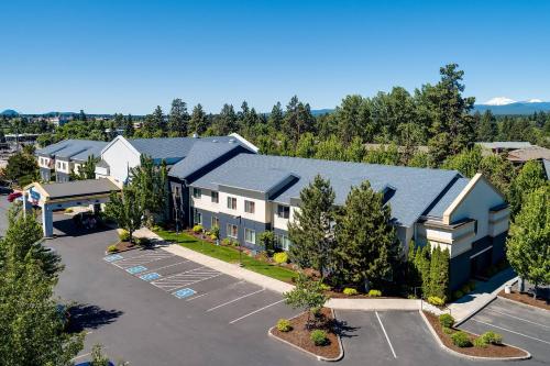 an aerial view of a building with a parking lot at Fairfield Inn & Suites Bend Downtown in Bend