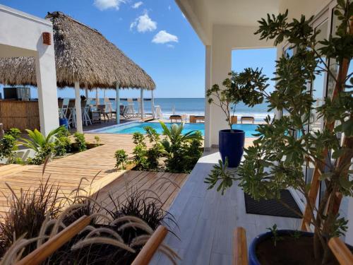 a patio with a view of the beach and the ocean at AZVLIK in Rivas