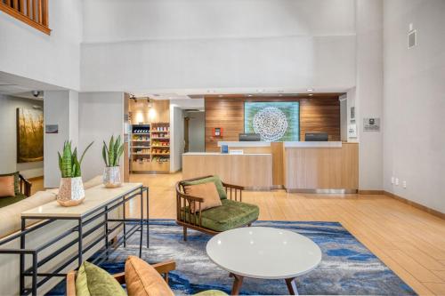 a living room with a couch and a table at Fairfield Inn & Suites Rancho Cordova in Rancho Cordova