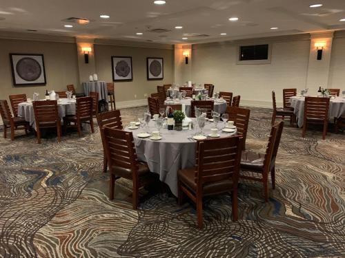 a dining room with tables and chairs in a room at Holiday Inn Resort Lake George by IHG in Lake George