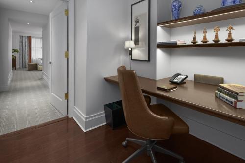 a home office with a desk and a chair at InterContinental New York Barclay Hotel by IHG in New York