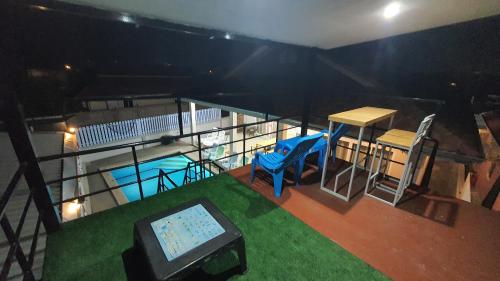 an overhead view of a balcony with a swimming pool at Family POOL VILLA CHAAM in Cha Am