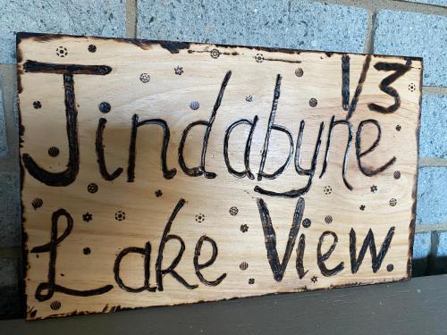 a sign that reads turtles furniture late view at Jindabyne Lake View in Jindabyne