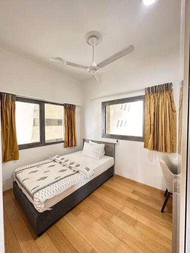 a bedroom with a bed and a ceiling fan at Altair Colombo - View, Location, Ultra Luxury! in Colombo