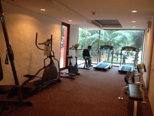 a gym with several exercise equipment in a room at Las Tortugas, Cozy condominium on Khao Tao beach, Hua Hin in Khao Tao