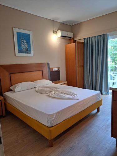 מיטה או מיטות בחדר ב-Bristol Apartments