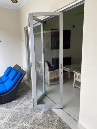 a room with a sliding glass door leading to a living room at 5 Bedroom Holiday Villa - Kuta Regency B8 in Kuta