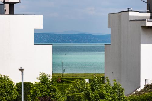a view of the ocean from a building at Gold Wave Apartments in Siófok