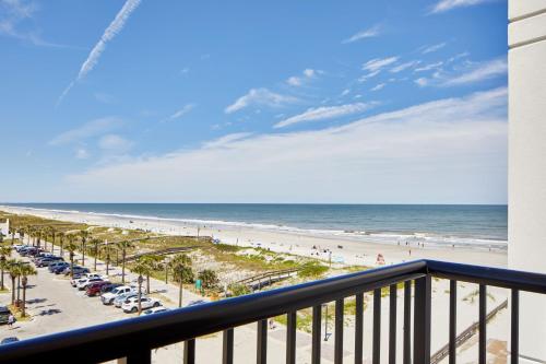 a view of the beach from the balcony of a condo at SpringHill Suites by Marriott Jacksonville Beach Oceanfront in Jacksonville Beach