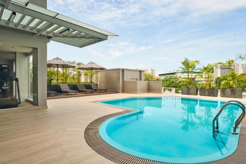 a swimming pool on the roof of a house at Holiday Inn Express & Suites Singapore Novena, an IHG Hotel in Singapore