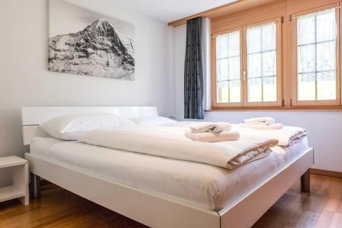 Giường trong phòng chung tại Apartment Dolce Vita - GRIWA RENT AG