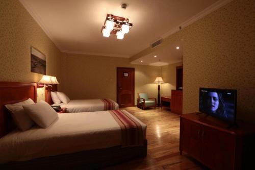 Postel nebo postele na pokoji v ubytování Abyssinia Renaissance Hotel