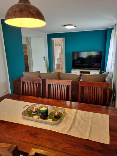 a living room with a table and a couch at Ferienhaus Stefan in Kall