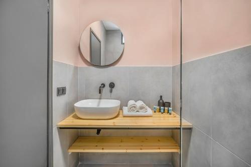 a bathroom with a sink and a mirror at Estival Concept in Paliouri