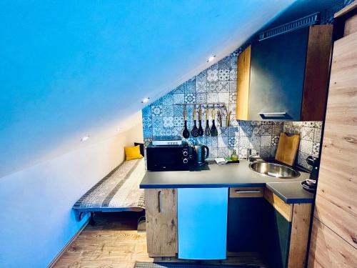 Una cocina o zona de cocina en Apartmány v ráji (Českém)