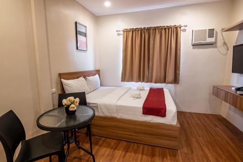 Katil atau katil-katil dalam bilik di Kiwi Hotel