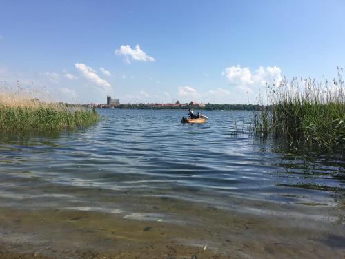 two people in a small boat on a lake at Rosalee in Strehlow