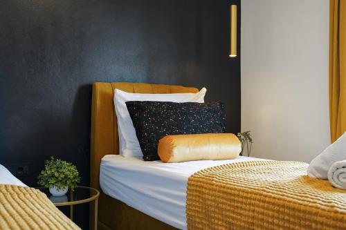 a bedroom with a bed with a wooden headboard at TEONA Luxury Apartment with 2 rooms and terrace sea view in Sali