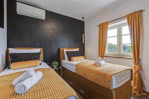 Postelja oz. postelje v sobi nastanitve TEONA Luxury Apartment with 2 rooms and terrace sea view
