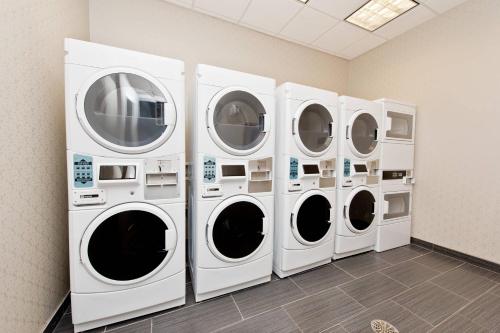 four washing machines are lined up in a room at Residence Inn by Marriott Austin Southwest in Austin