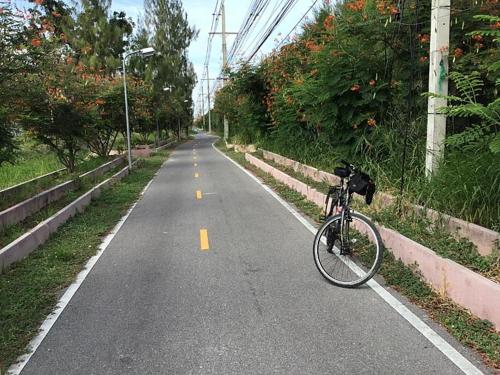 a bike parked on the side of a road at Las Tortugas, Cozy condominium on Khao Tao beach, Hua Hin in Khao Tao