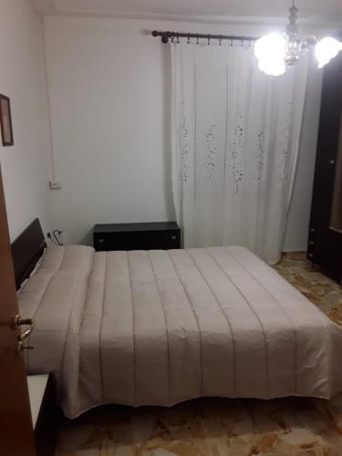 מיטה או מיטות בחדר ב-Appartamento claudio