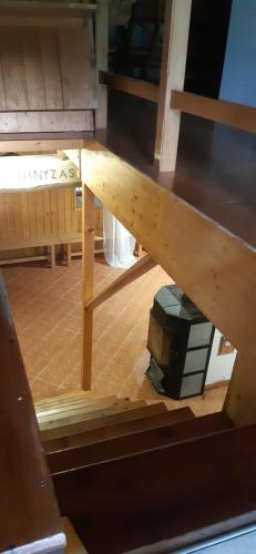 a wooden table with a box on the floor at Prém Malom Vendégház in Bakonynána