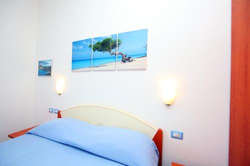 Postel nebo postele na pokoji v ubytování Casa Vacanze Rosy " Nel Centro"