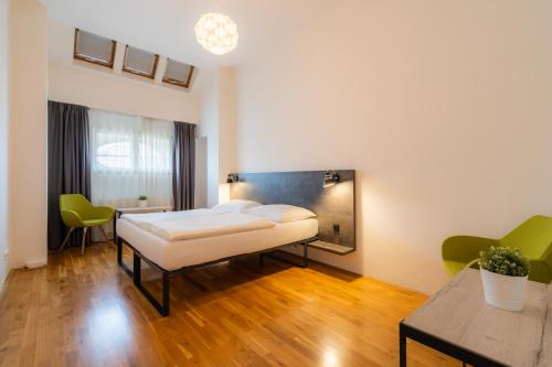 a hospital room with a bed and a table at EA ApartHotel Melantrich in Prague