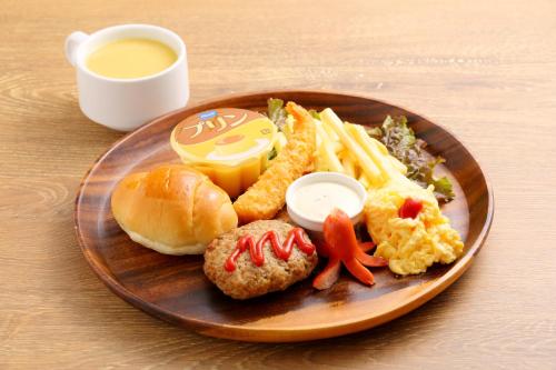 a plate of food with a sandwich and a hamburger at Richmond Hotel Sapporo Ekimae in Sapporo