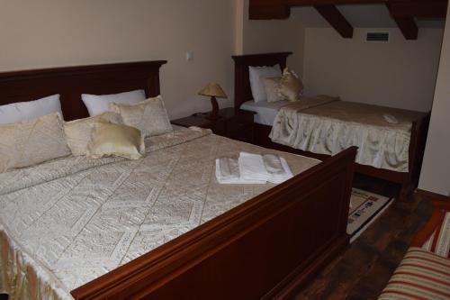 Postel nebo postele na pokoji v ubytování Hotel Tivoli