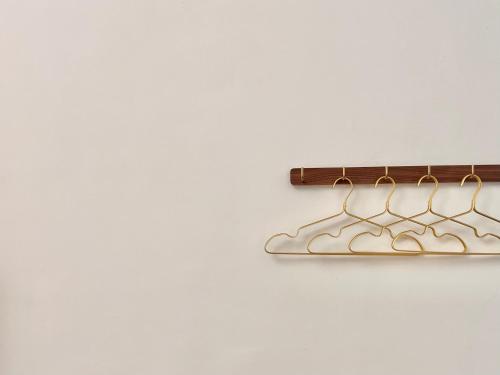 a pair of metal hangers hanging on a wall at 台東永安101民宿-可包棟 in Taitung City