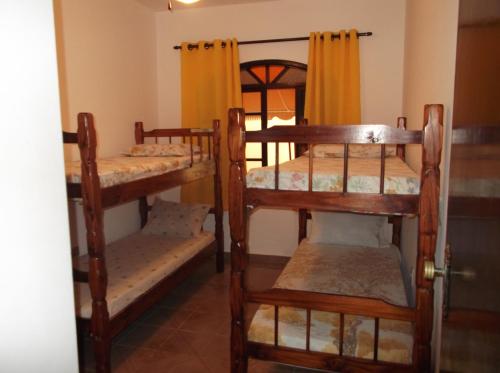 Krevet ili kreveti na kat u jedinici u objektu Vênus Apartamentos