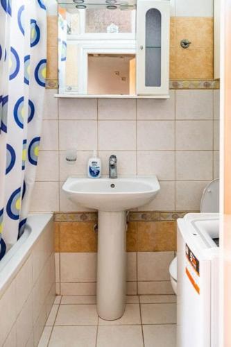 a bathroom with a sink and a toilet at Steffi's Place,Corfu Old Town in Corfu