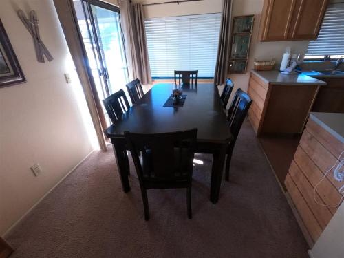 a dining room table and chairs in a kitchen at Rr-edgewater13 in June Lake